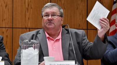 Rick Johnson chairs the committee as it meets before a capacity crowd in Lansing, Mich., June 26, 2017, at the first open meeting of the Michigan Medical Marijuana Board.