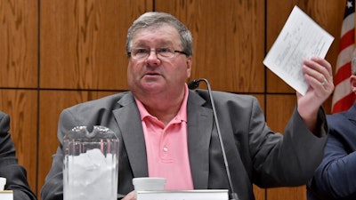 Rick Johnson chairs the committee as it meets before a capacity crowd in Lansing, Mich., June 26, 2017, at the first open meeting of the Michigan Medical Marijuana Board.