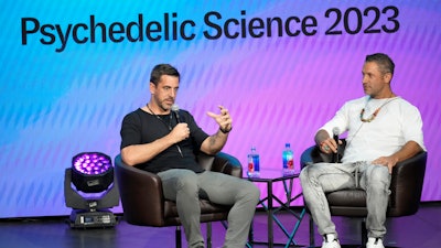 New York Jets quarterback Aaron Rodgers, left, chats with entrepreneur Aubrey Marcus during a program at the Psychedelic Science conference in the Colorado Convention Center Wednesday, June 21, 2023, in Denver.