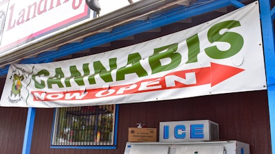 An evidence seizure image provided by the Washington State Liquor and Cannabis Board of a business banner advertising cannabis.