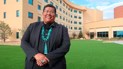 Dineh Benally poses for a photograph before a Navajo Nation presidential forum at a tribal casino outside Flagstaff, Ariz., Tuesday, June 21, 2022.