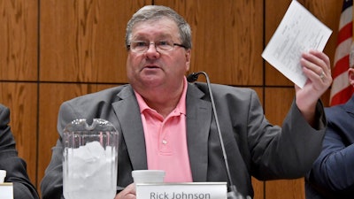 Rick Johnson chairs the committee as it meets before a capacity crowd in Lansing, Mich., June 26, 2017, at the first open meeting of the Michigan Medical Marijuana Board.