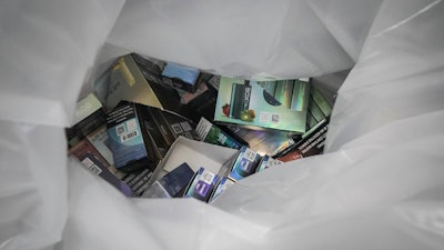 Vaping products are bagged and confiscated, during a spot raid of a tobacco store by members of New York Sheriff's Joint Compliance Task Force (SJCTF), Wednesday Sept. 27, 2023, in New York.