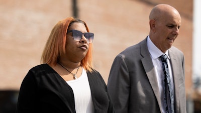 Deja Taylor arrives to the United States Courthouse in Newport News, Va., on Thursday, Sept. 21, 2023, with her lawyer James Ellenson.