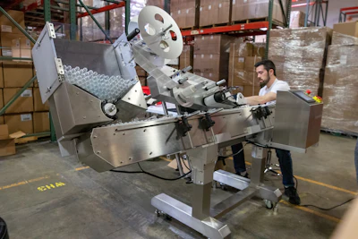An automated pre-roll labelling machine.