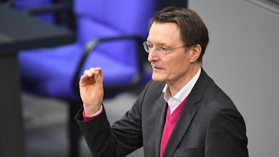 German Minister of Health Karl Lauterbach speaks during the debate on the law on the controlled release of cannabis in the plenary chamber of the German Bundestag, in Berlin, Friday Feb. 23, 2024.