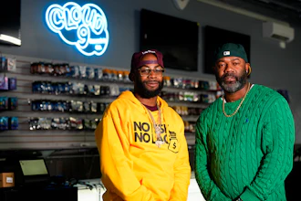 Cloud 9 Cannabis CEO and co-owner Sam Ward Jr., left, and co-owner Dennis Turner pose at their shop, Thursday, Feb. 1, 2024, in Arlington, Wash. Cloud 9 is one of the first dispensaries to open under the Washington Liquor and Cannabis Board's social equity program, established in efforts to remedy some of the disproportionate effects marijuana prohibition had on communities of color.