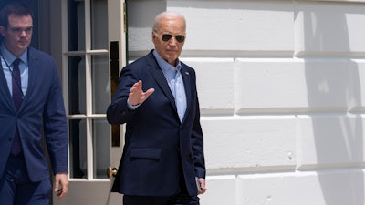 President Joe Biden waves as he walks to Marine One for departure from the South Lawn of the White House, Tuesday, April 30, 2024, in Washington.
