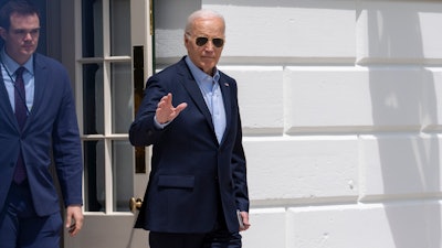 President Joe Biden waves as he walks to Marine One for departure from the South Lawn of the White House, Tuesday, April 30, 2024, in Washington.