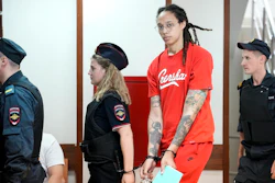 WNBA star and two-time Olympic gold medalist Brittney Griner, second from right, is escorted to a courtroom for a hearing in Khimki outside Moscow, Russia, July 7, 2022. Griner continues her efforts to settle into a normal routine following her release from a Russian prison 17 months ago.