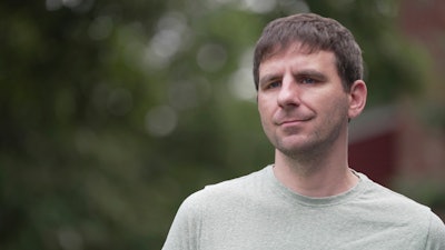 Casey Tylek, a U.S. Army veteran, stands for a portrait at his home in Leominster, Mass., on July 13, 2024. Tylek credits MDMA-assisted therapy with resolving anger, anxiety and trauma stemming from a rocket attack in in Iraq.