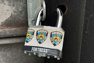 A New York City Sheriff's Department padlock secures Spark & Brew, an illegal cannabis shop, in the Queens borough of New York, Tuesday, July 23, 2024. For several years, local law enforcement weren't allowed to close illegal pot shops without a protracted legal battle. But a new state law allows the sheriff's department to padlock stores quickly, and keep them closed in most cases while stores appeal.