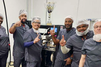 The Southern Crop team in front of a RollPros Blackbird pre-roll machine with their trophy for winning the Best in Class Pre-Rolls award at the Magnolia Cup.