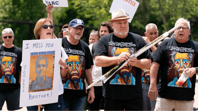 Lisa Hyland, left, and other family members of Marc Fogel, who has been detained in Russia since August 2021, rally outside the White House for his release, July 15, 2023, in Washington.