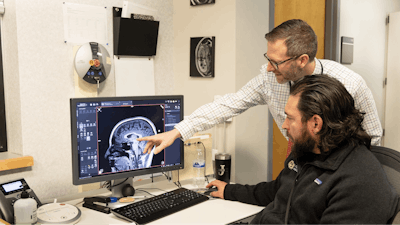 Dr. Josh Gowin looking at a brain scan.