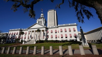 The old Florida Capitol is seen with the tower of the current Capitol rising behind, during a legislative session in Tallahassee, Fla., March 6, 2025.