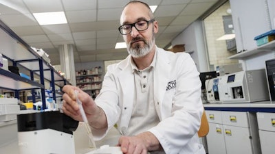 Chris Pudney operating the drug-detection device developed at the University of Bath.