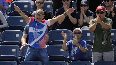 Tennis fans show support for Alexandra Eala, of the Philippines, against Clara Tauson, of Denmark, during the first round of the US Open tennis championships, Sunday, Aug. 24, 2025, in New York.