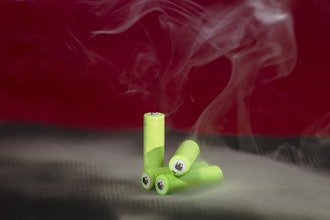 A stock image of green batteries smoking.