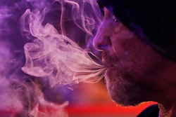 Miguel Laboy smokes cannabis, Oct. 3, 2025, in Brookline, Mass.