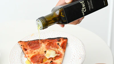 Oui'd Chef Man Drizzling On Pizza