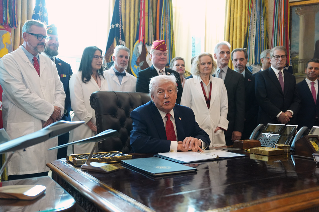 President Donald Trump speaks during an executive order signing in the Oval Office of the White House, Thursday, Dec. 18, 2025, in Washington.