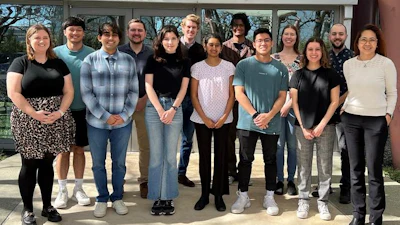 Director of UT Dallas' Neuroimaging of Reward Dynamics (NiRD) Lab Francesca Filbey, PhD, with lab members outside her workspace at Center for BrainHealth.