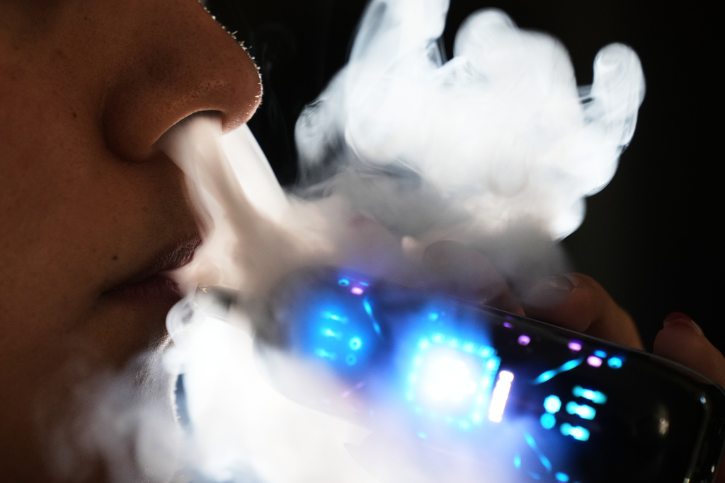 Ximena Fernandez vapes while working remotely from home in Mexico City, Friday, Jan. 30, 2026.