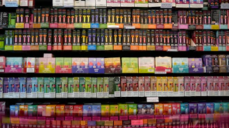 Disposable flavored electronic cigarette devices are displayed for sale at a store in Pinecrest, Fla., June 26, 2023.