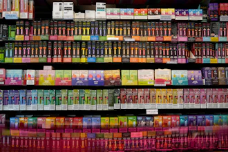 Disposable flavored electronic cigarette devices are displayed for sale at a store in Pinecrest, Fla., June 26, 2023.