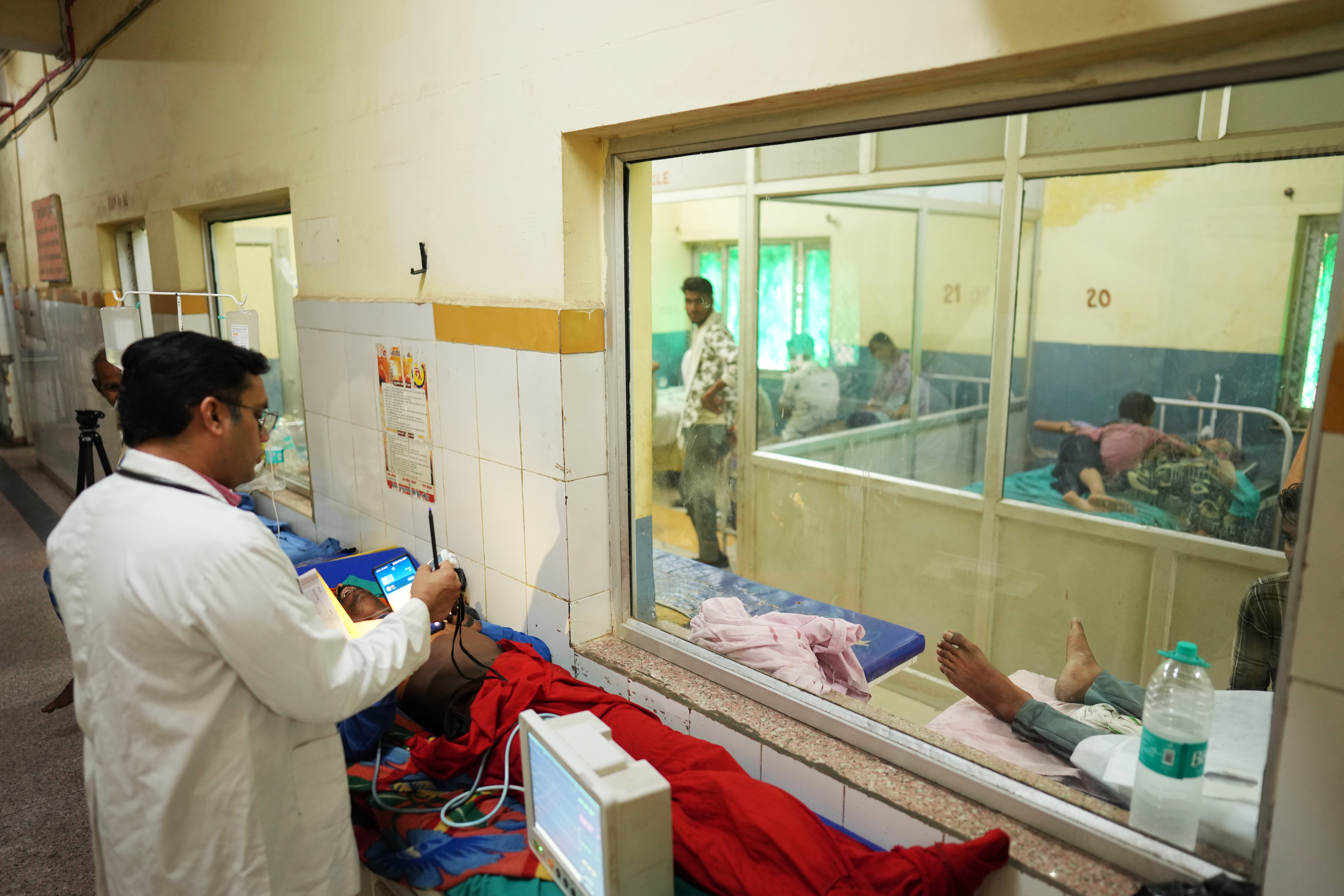 Dr. Abhishek Pranayami examines a patient suffering from a heat-related illness amid high temperatures at a district government hospital in Banda, northern Indian state of Uttar Pradesh, June 19, 2026.