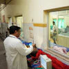 Dr. Abhishek Pranayami examines a patient suffering from a heat-related illness amid high temperatures at a district government hospital in Banda, northern Indian state of Uttar Pradesh, June 19, 2026.