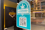 New York State licensed cannabis dispensary verification badge with QR code on storefront