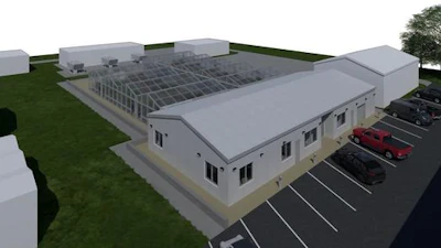 3D architectural rendering of a modern industrial building with rooftop solar panels and parking lot