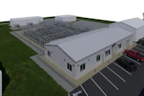 3D architectural rendering of a modern industrial building with rooftop solar panels and parking lot