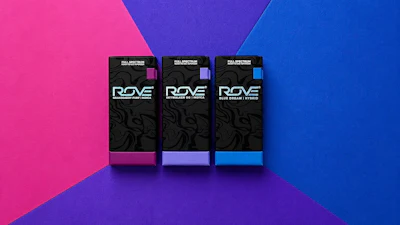 Three ROVE product boxes with pink, purple, and blue accents displayed on gradient background